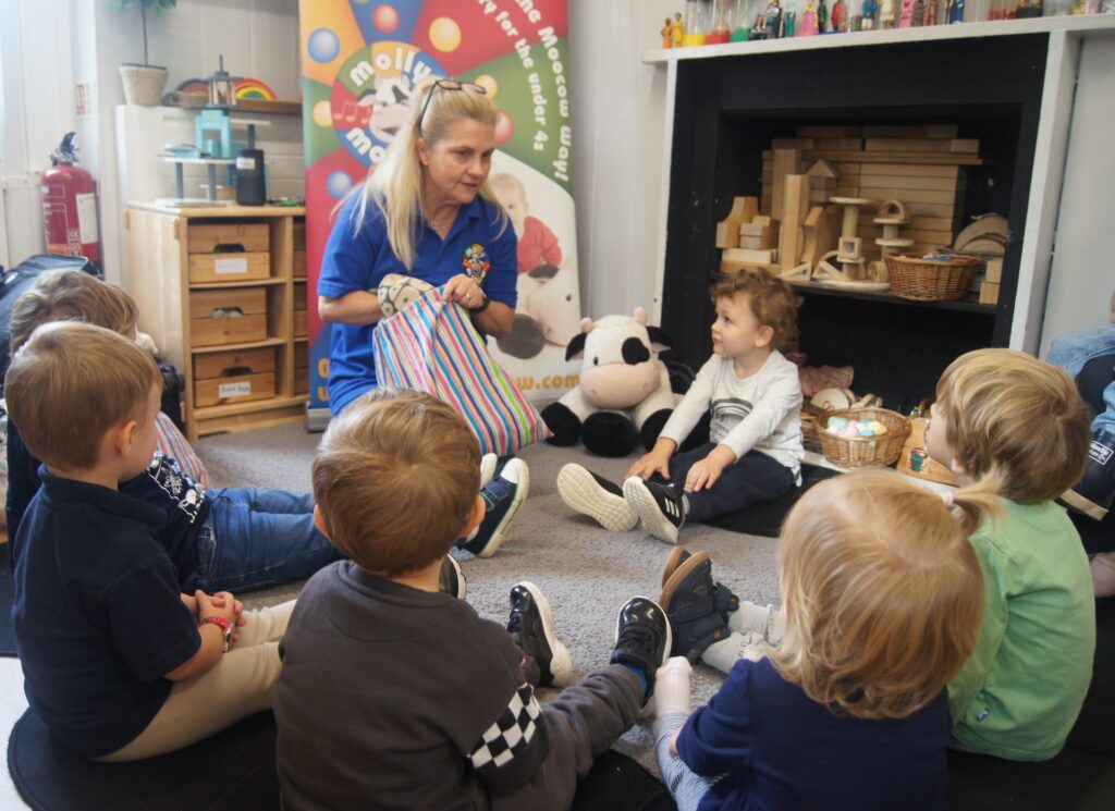 Children listening to Molly Moocow teacher