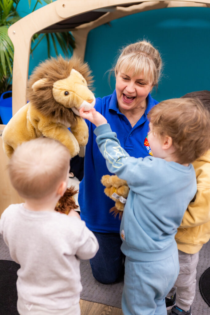 Children and Molly Moocow Teacher with a Lion puppet